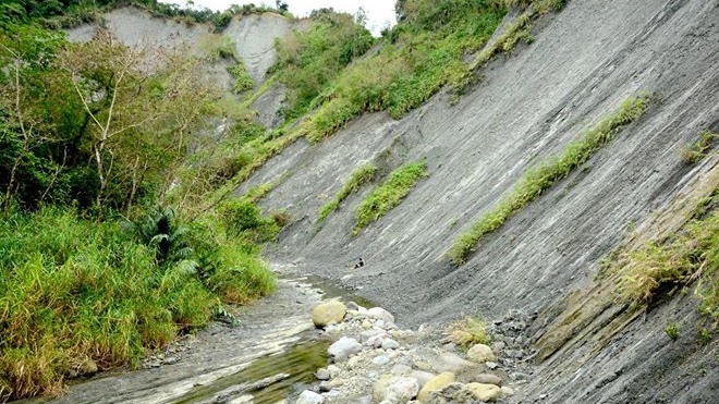 Bedrock river channel in steep terrain.