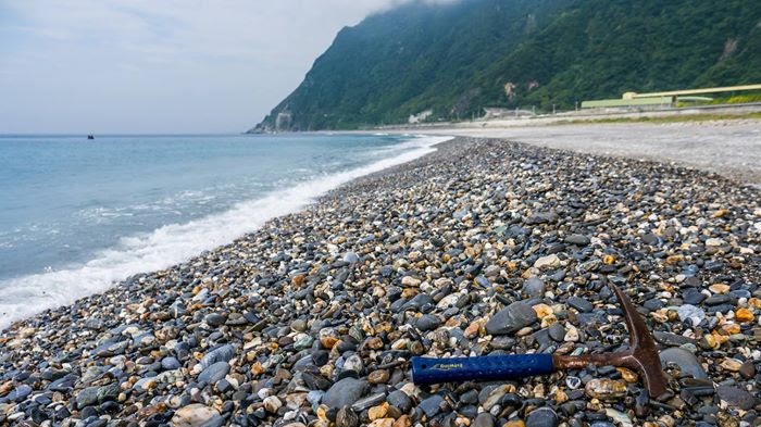 Gravel beach and coastal sediment.